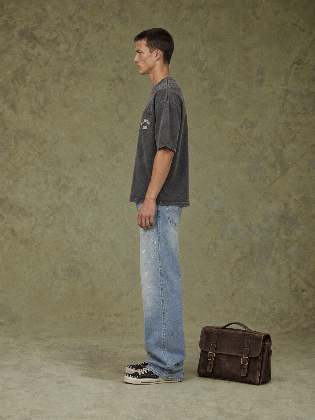 Pocket T-shirt Sprayed Black by Art. Department, worn by model, side view